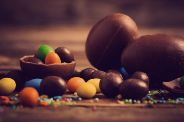 Chocolate Easter Eggs Over Wooden Background