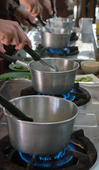 Stainless steel pots on gas burners