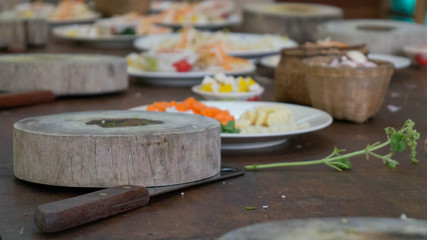 Wooden cutting block and healthy ingredients for an asian meal