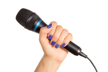 Woman's hand holding a microphone