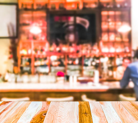 scene of wooden table top with abstract blurred background in open restuarant.  -blurred.