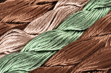 Colorful skeins silk embroidery floss as background texture