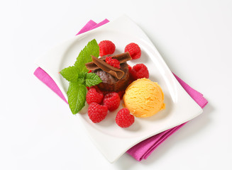 Mini chocolate cake with fresh raspberries and ice cream