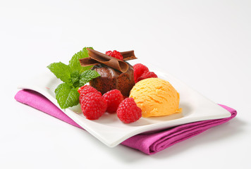 Mini chocolate cake with fresh raspberries and ice cream