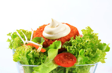 Green salad with fried breaded cheese