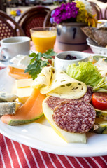 Fresh Sliced raw beef meat with leaf lettuce on the table