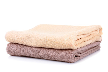 Fototapeta na wymiar folded clean towels on a white background isolated