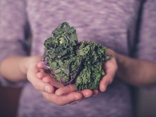 Young woman with brussel sprouts