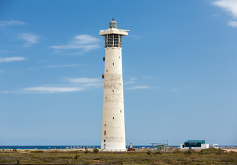 Fototapeta na wymiar Lighthouse on Playa del Matorral, Jandia Morro Jable, Fuerteventura Spain