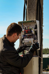 Electrician perform the electrical montage of the control board.