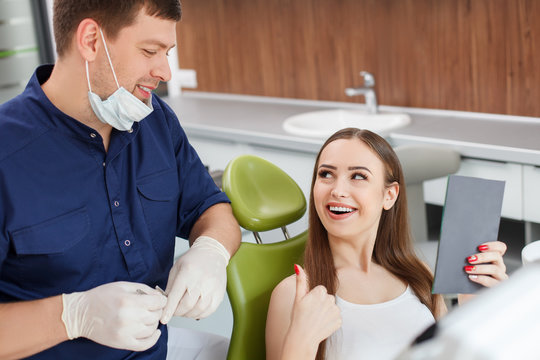 Attractive young girl is visiting a dental doctor
