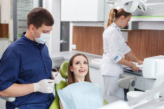Cheerful young woman came to visit her dentist