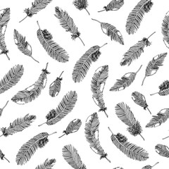 Seamless ethnic pattern with black feathers on white background. Vector illustration.