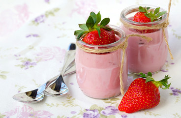 Strawberry yogurt in a glass cup