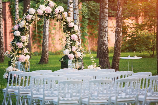 Fototapeta Outdoor wedding ceremony decoration , wedding arch with peony flowers