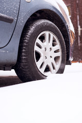 Naklejka premium Tire at snow. Winter. Shallow depth of field.