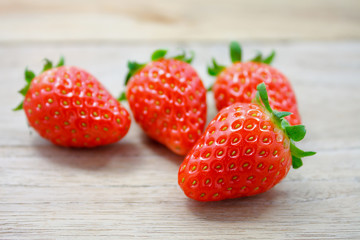 Fresh strawberries on wooden background