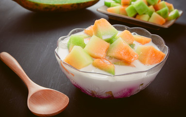Thai style sweet dessert, muskmelon eat with sweet coconut milk