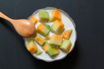 Thai style sweet dessert, muskmelon eat with sweet coconut milk