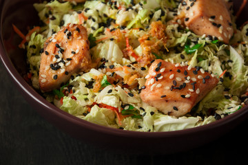 Fresh salad with napa cabbage, carrot, chicken, cilantro and sesame seeds