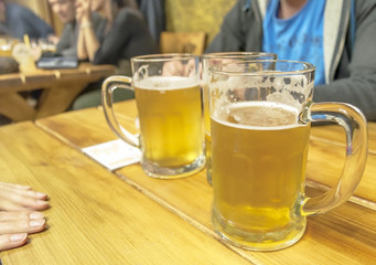 Friends with a fresh beer close