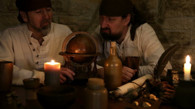 two pirates are chosing the next destination, medieval decoration, vintage looking background