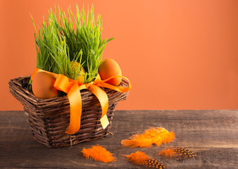 orange easter eggs in a basket