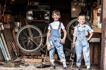 Fototapeta na wymiar Children mechanics, bicycle repair
