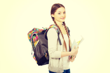 Teenager girl with school backpack.