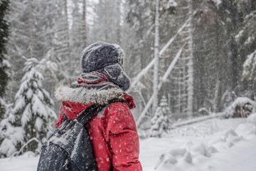 Fototapeta na wymiar Traveler woman on winter trail looking for new adventure