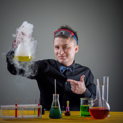 magician in chemical laboratory prepares magical solution