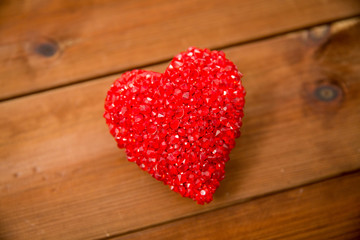 Obraz na płótnie Canvas close up of red heart decoration on wood