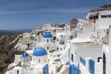 Blue domed churches on the Caldera at Oia on the Greek Island of
