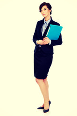 Businesswoman holding a binder.