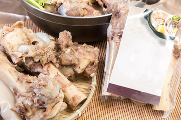 Chinese New Year dishes.Pig bone riser heating market to sell the ready-to-eat food packets and pig bones