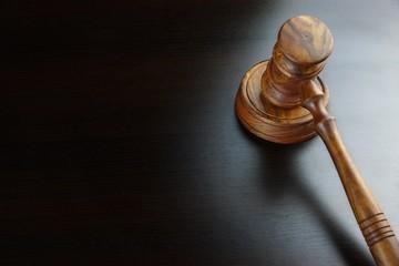 Judges Or Auctioneers Walnut Gavel On The Black Table