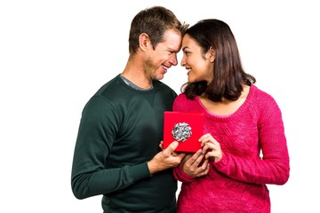 Happy couple holding gift box 