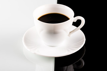 coffee cup on white and black background
