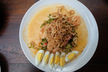 wing bean shrimp salad in white plate
