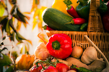 Colorful vegetables basket wooden table