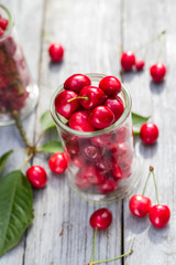 Freshly picked cherries raspberry fruits table