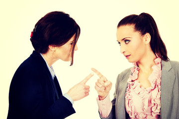 Angry businesswomans pointing on each other.