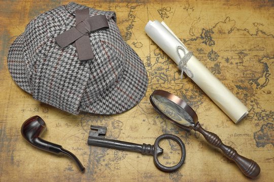 Overhead View Of Sherlock Hat And Detective Tools On Map