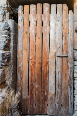 Old door made from rough planks of wood.