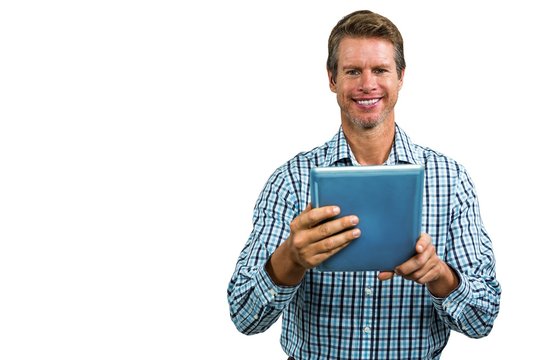 Portrait of happy man using tablet