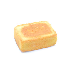Fruit cake squares on white background.