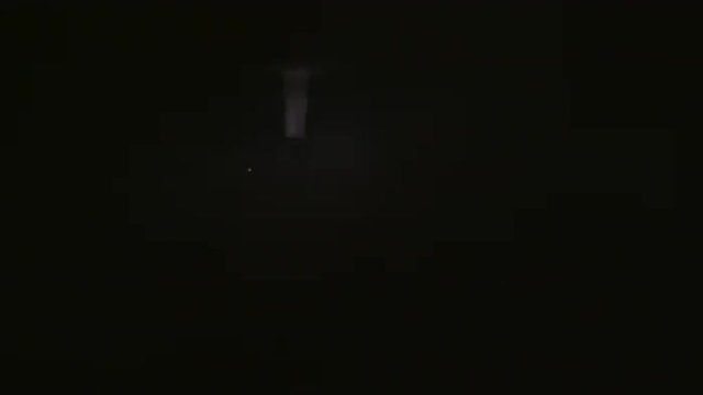 Sped up view of the monumental Christ sculpture through nighttime clouds.