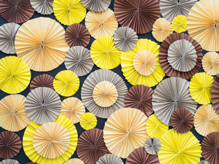 Colorful paper flower on board