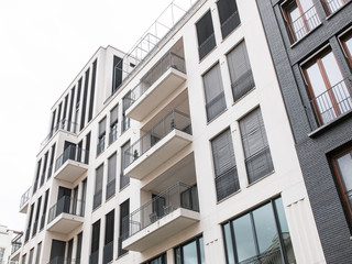 Looking up view of apartments with balconies