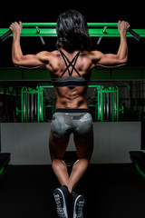 Color image of woman working out in the gym with weights